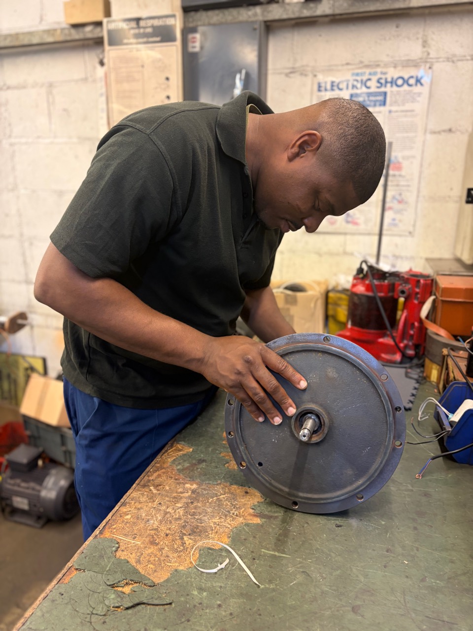 Ainsley working on a motor at the GMT workshop