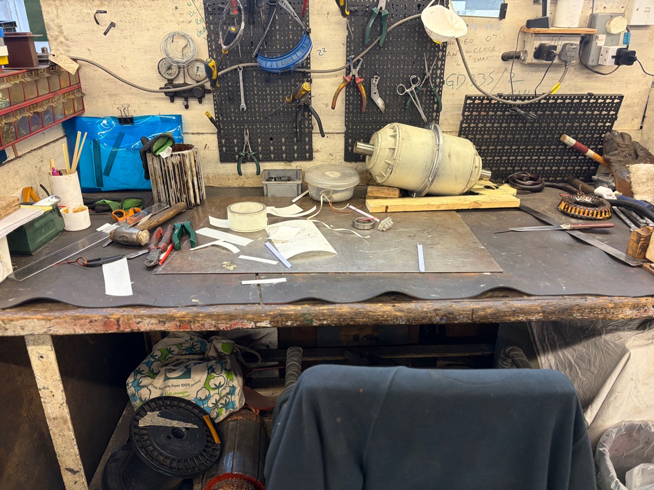 Workshop bench with tools and motor repair equipment
